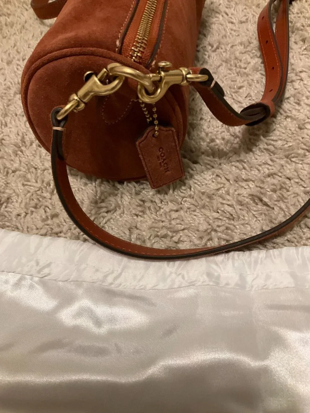 COACH barrel bag. brass/clay. CDy81.